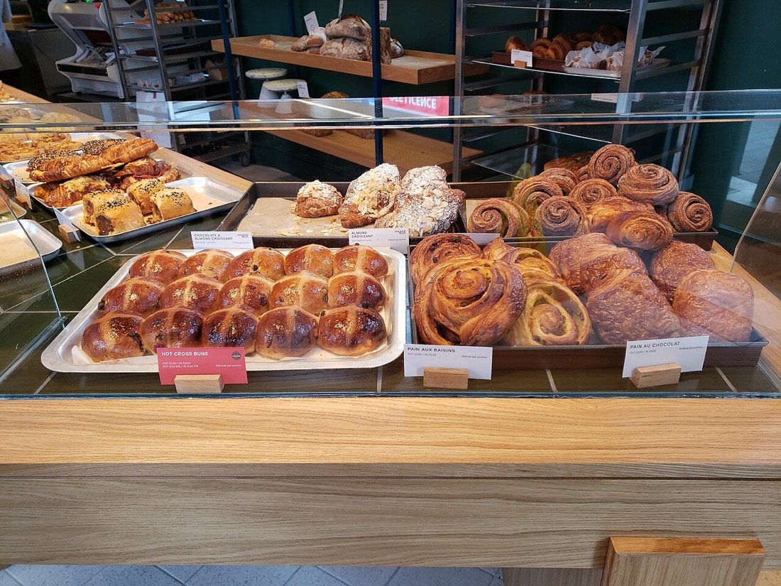 Pastries and bread on display in a bakery