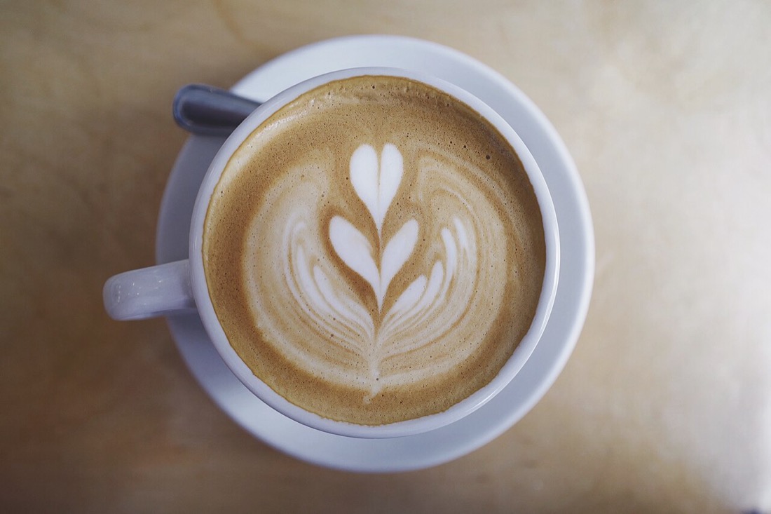 A latte with latte art in a cafe